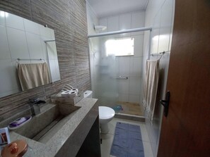 Shower, towels, soap, toilet paper