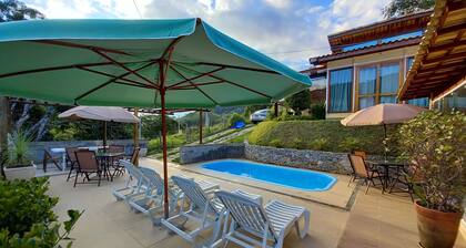 Country house with pool and outbuilding.