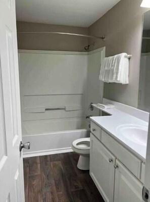 Bathtub, hair dryer, towels, soap