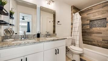 Combined shower/tub, hair dryer, towels, soap