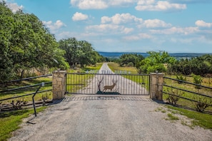 Enter a serene natural setting, surrounded by lush greenery and a tranquil atmosphere.