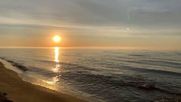 On the beach, sun-loungers, beach towels