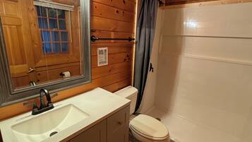 Combined shower/tub, hair dryer, towels, soap