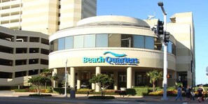 Beach Quarters offers a unique, rounded corner design with a series of windows along its facade.