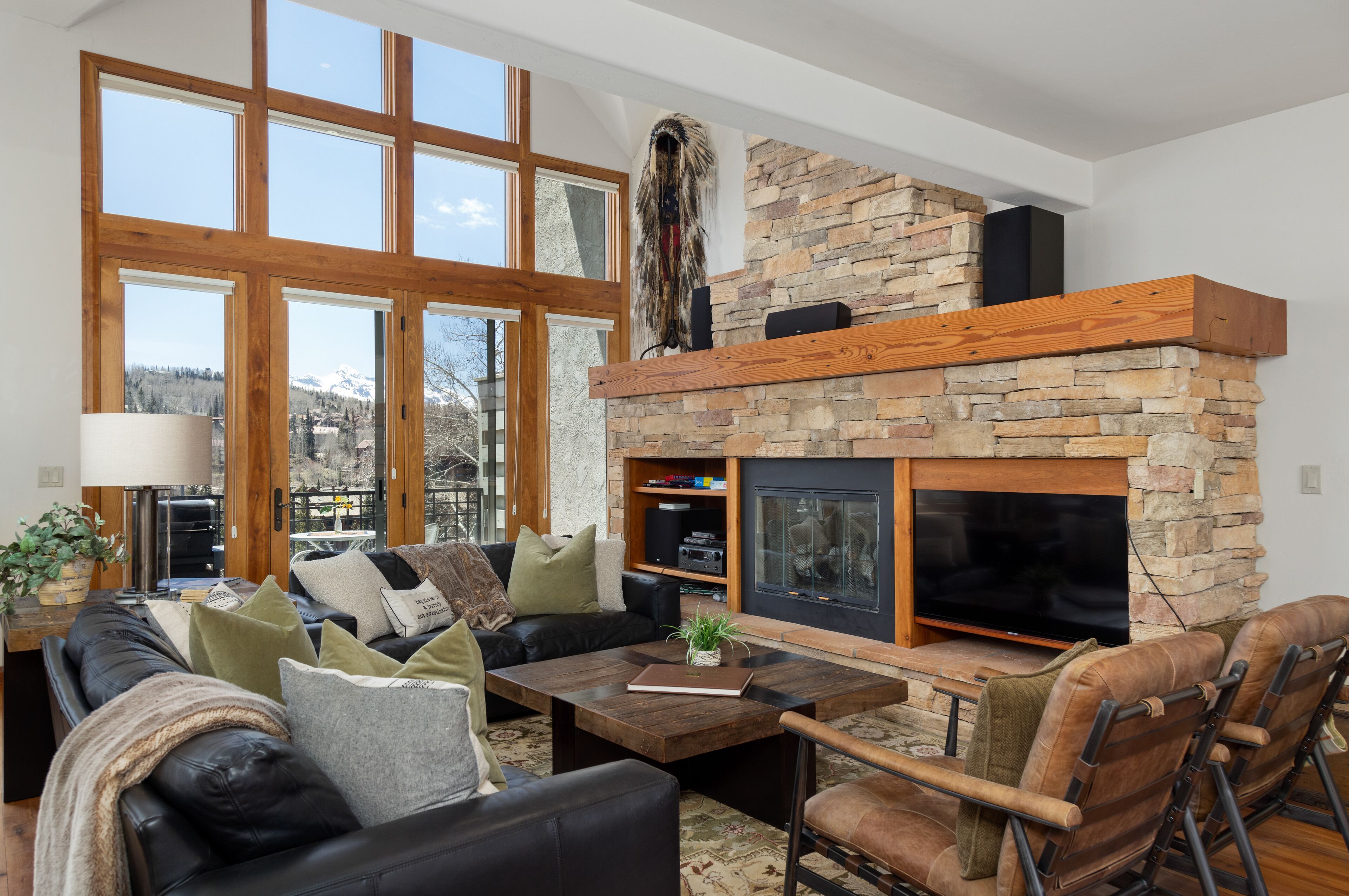 Upscale ski-in/out condo with private hot tub, grill, fast WiFi & mountain views