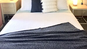 A neatly made bed with white and dark pillows, a dark throw blanket, and a wall-mounted abstract art piece above. - ⭐BROOKS⭐BFast,WiFi,Nflx⭐UberEats, Walk2Shop, (Norlane)