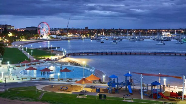 A waterfront park with a Ferris wheel, a playground, and a marina with boats. - ⭐BROOKS⭐BFast,WiFi,Nflx⭐UberEats, Walk2Shop, (Norlane)