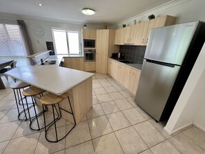 Fridge, microwave, oven, stovetop - Sandstone Point (SEQ) Bribie Holidays Family Home, pet friendly  (Sandstone Point)