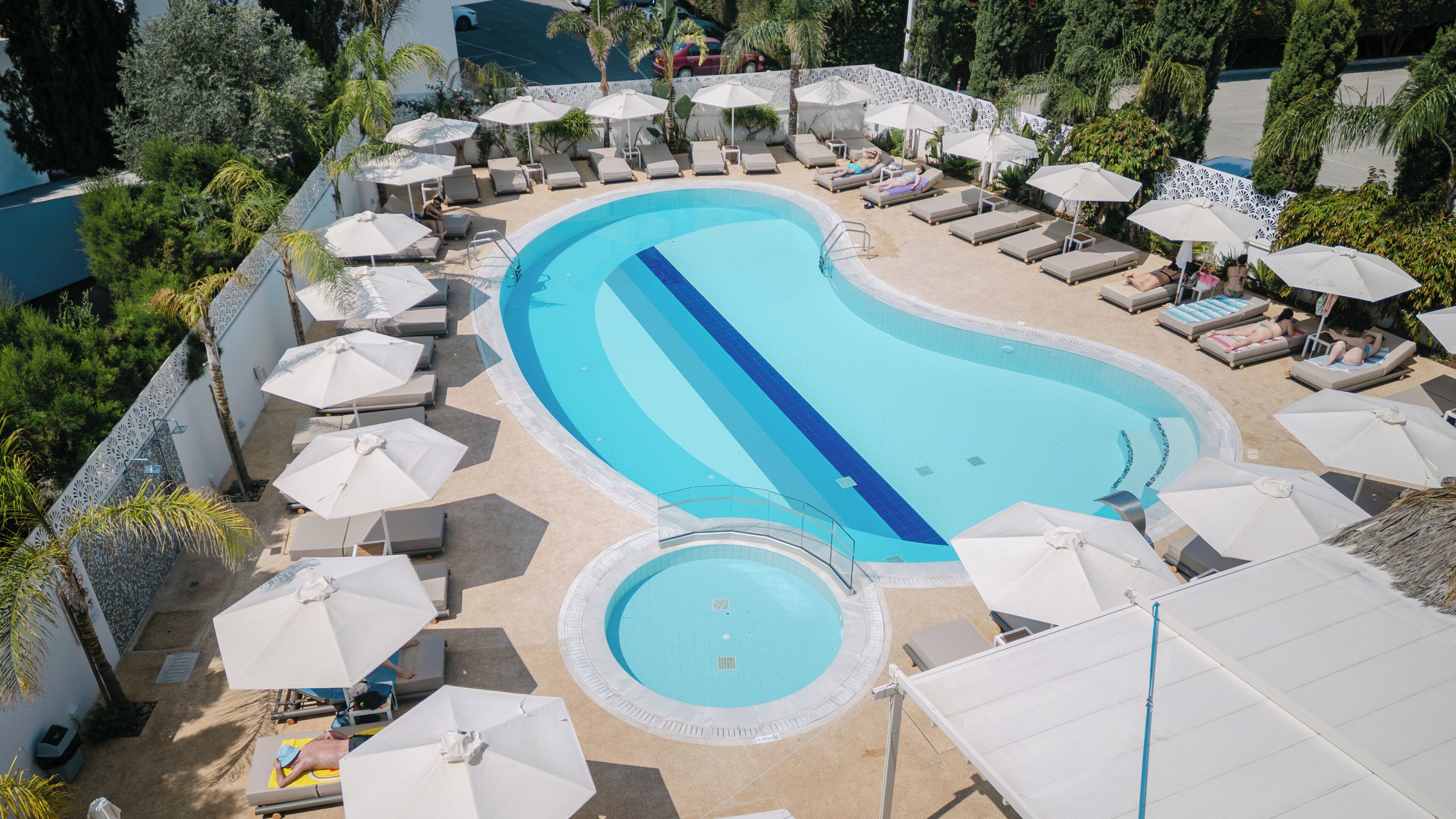 Seasonal outdoor pool, open 10:00 AM to 6:00 PM, pool umbrellas