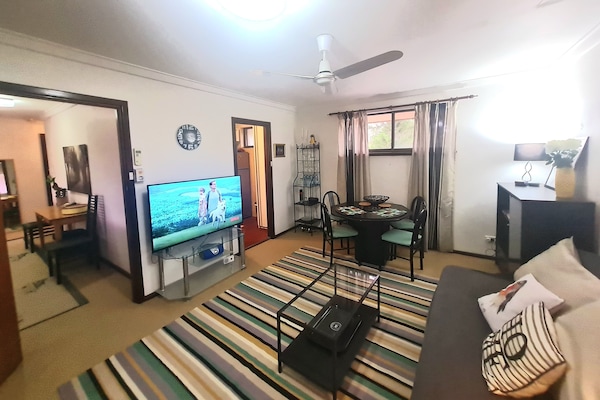 A delightful seating and dining area to relax and connect with family & friends.