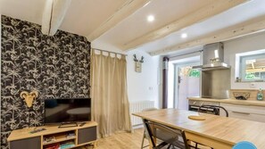 Fridge, toaster, dining tables