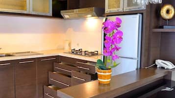 Fridge, electric kettle, cookware/dishes/utensils