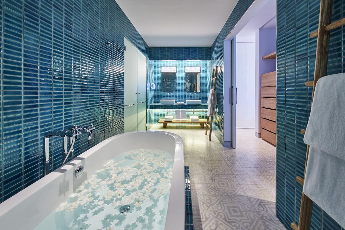 designer toiletries, hair dryer, bathrobes, slippers