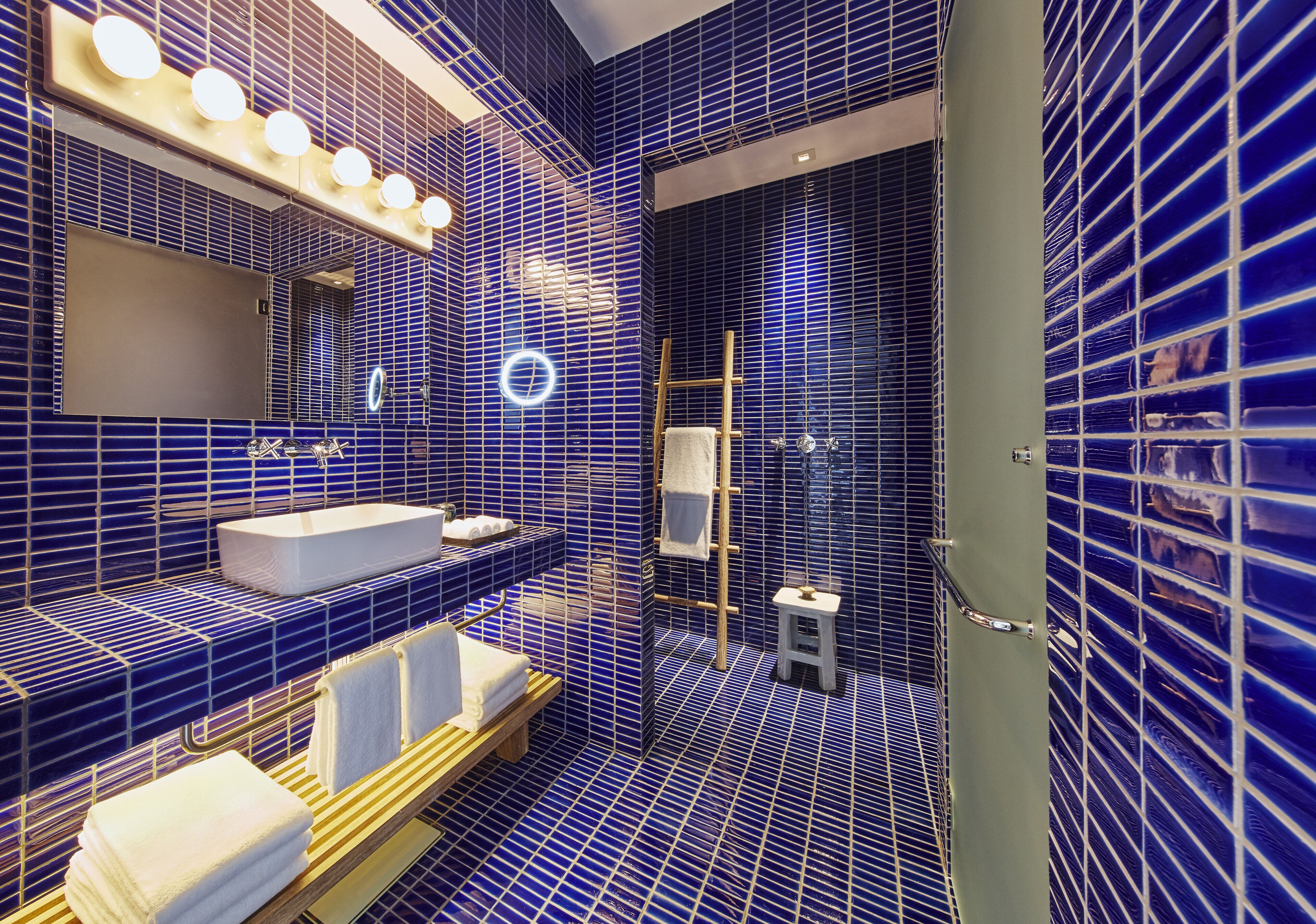 Designer toiletries, hair dryer, bathrobes, slippers