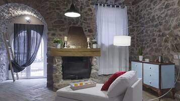 Deluxe Double Room | Living room | LCD TV, iPod dock