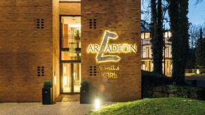 A building with a prominent illuminated sign reading "ARADEN Emil Karl". - QUARTIER 82 by Arcadeon (Hagen)