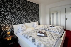Premium bedding, down comforters, desk, laptop workspace