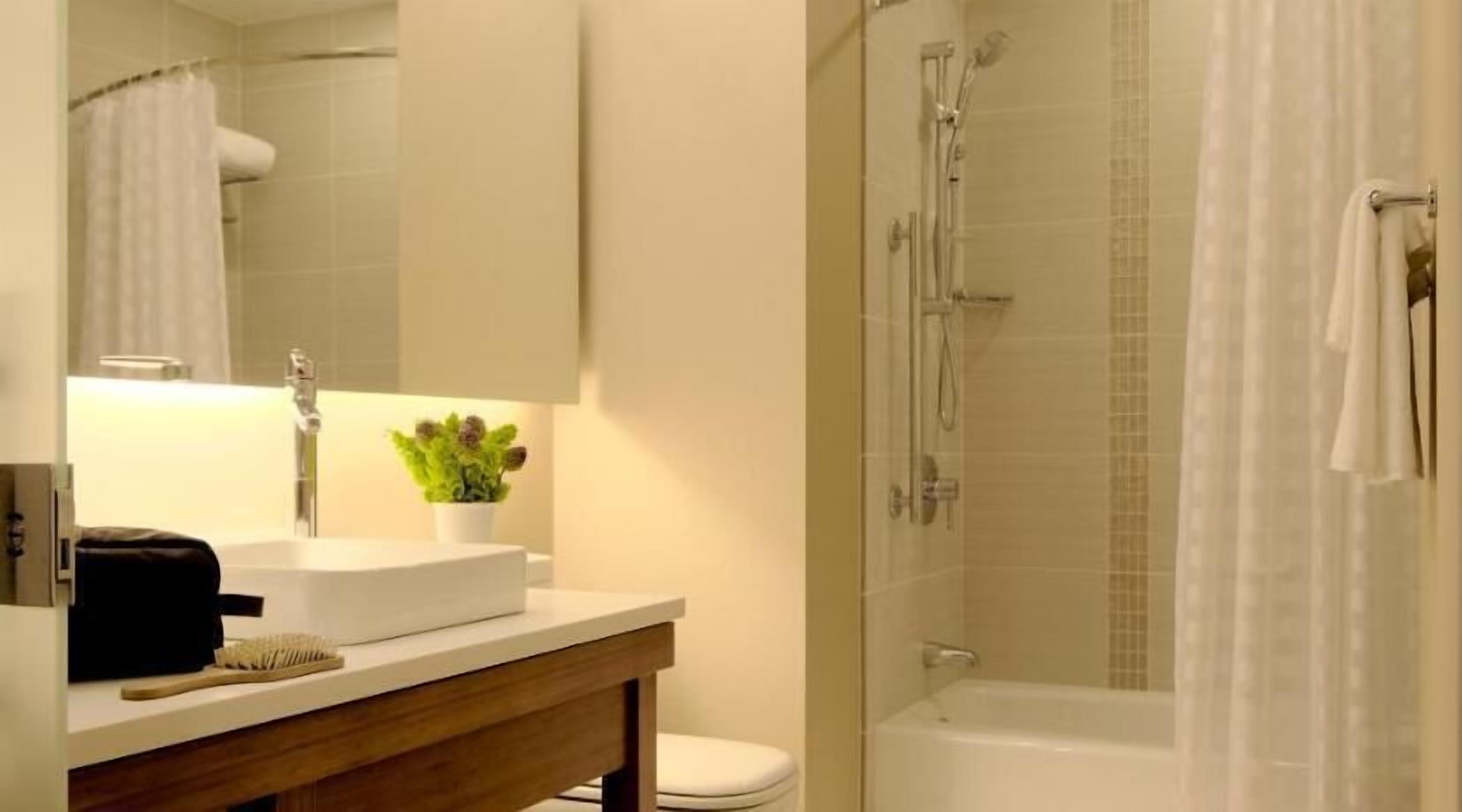 Bathroom | Deep soaking tub, designer toiletries, hair dryer, towels