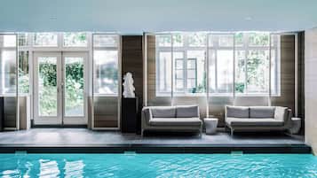 Indoor pool, open 9:00 AM to 6:00 PM, pool loungers
