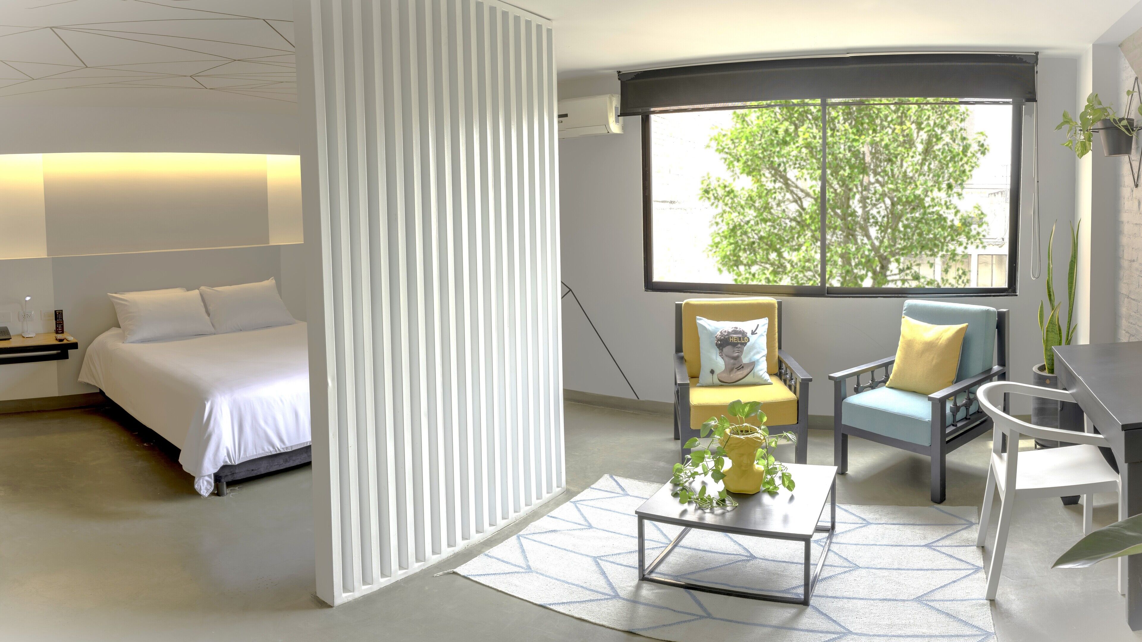 deluxe suite, city view | living area | 42-inch smart tv with cable channels, tv, heated floors