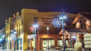 A hotel with a sign reading "Monte Villa Inn" and a "MonteVista Information Center" sign. - Monte Villa Hotel (Monte Vista)