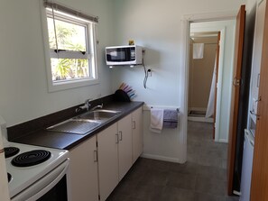 Family Two Bedroom | Private kitchen | Fridge, microwave, oven, stovetop