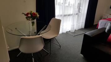 Studio, 1 King Bed | Living area | TV