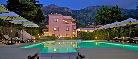 Seasonal outdoor pool, open 10:00 AM to 6:00 PM, pool umbrellas