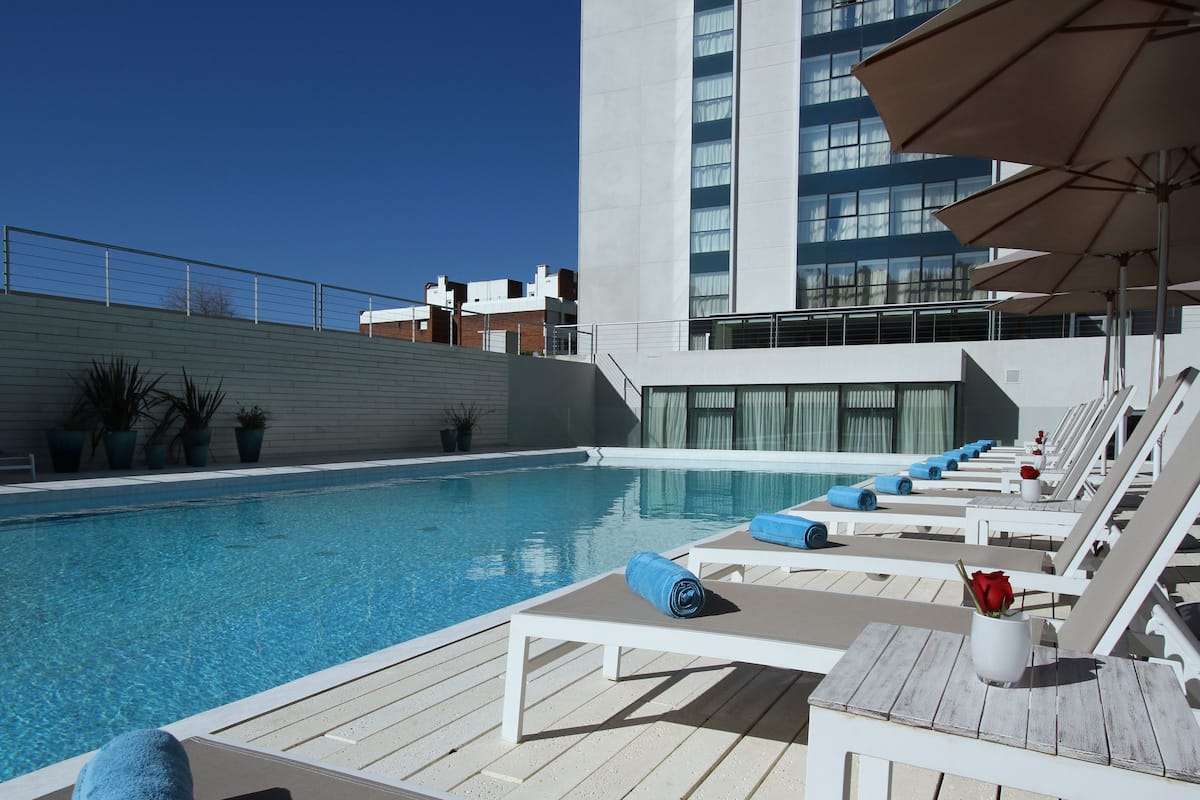 indoor pool, outdoor pool, pool loungers