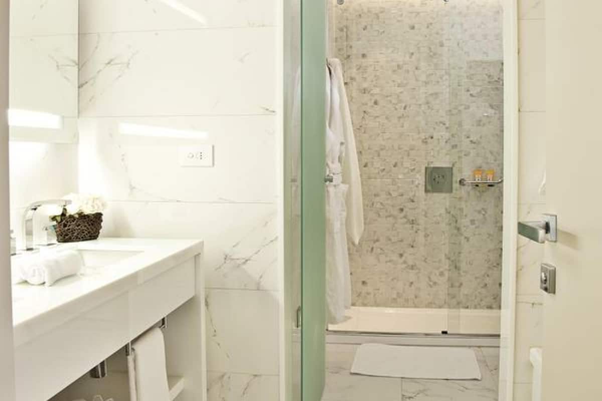 designer toiletries, hair dryer, bathrobes, slippers