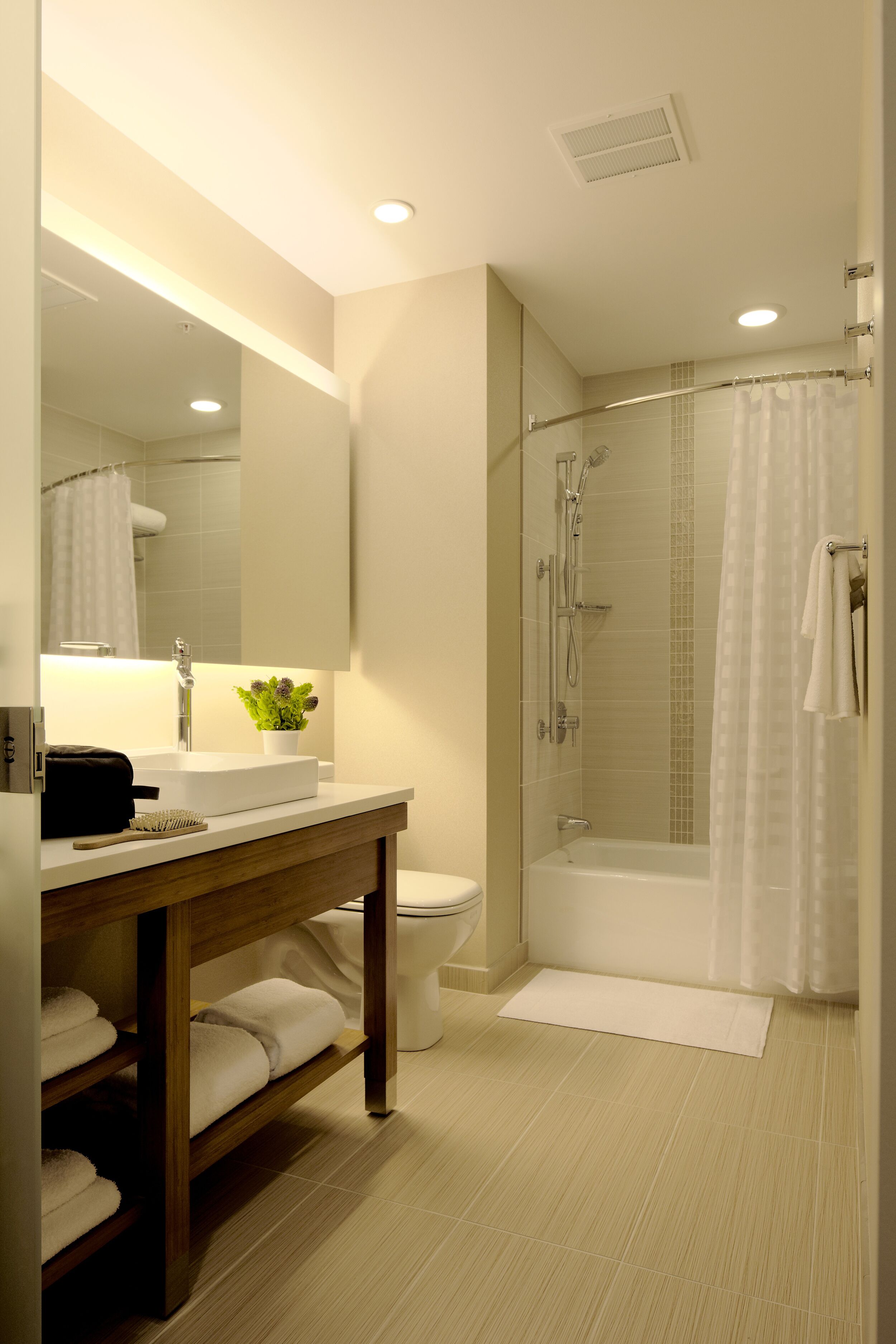 designer toiletries, hair dryer, towels