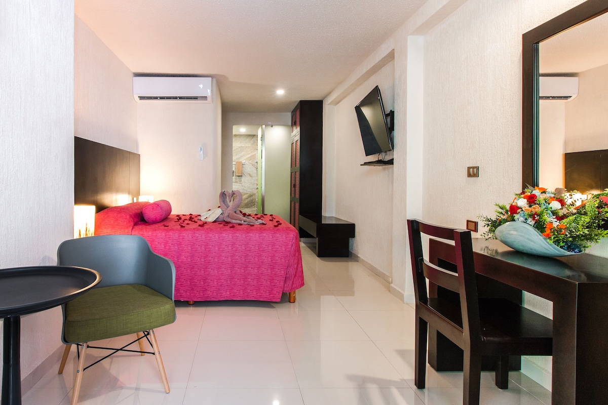 Premium bedding, down comforters, minibar, in-room safe