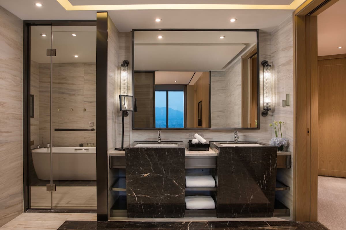 suite, 1 bedroom, smoking | bathroom | separate bathtub and shower, rainfall showerhead, designer toiletries