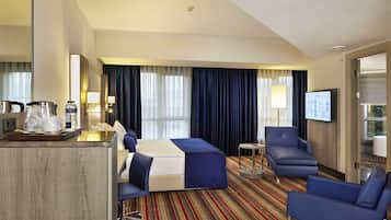 Suite, 1 King Bed, Smoking | 1 bedroom, premium bedding, in-room safe, laptop workspace