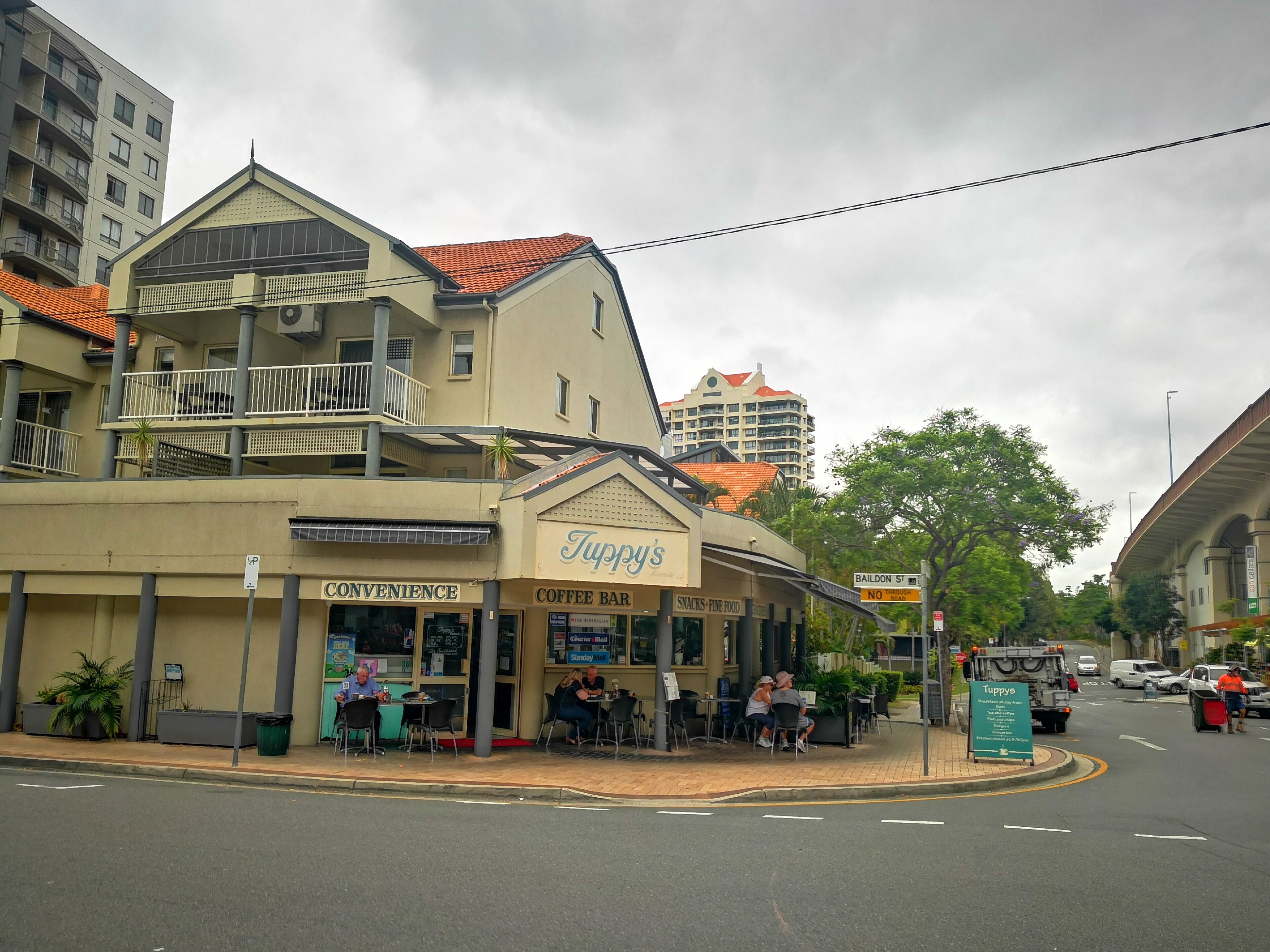 A two-story building with a coffee bar and convenience store on the ground floor.