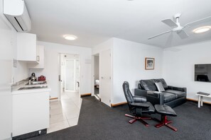 1 Bedroom Executive Apartment | Living area | 43-inch LED TV with satellite channels, TV