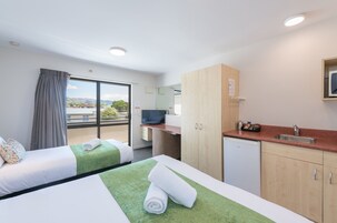 Twin/Triple Studio | Premium bedding, desk, blackout drapes, iron/ironing board