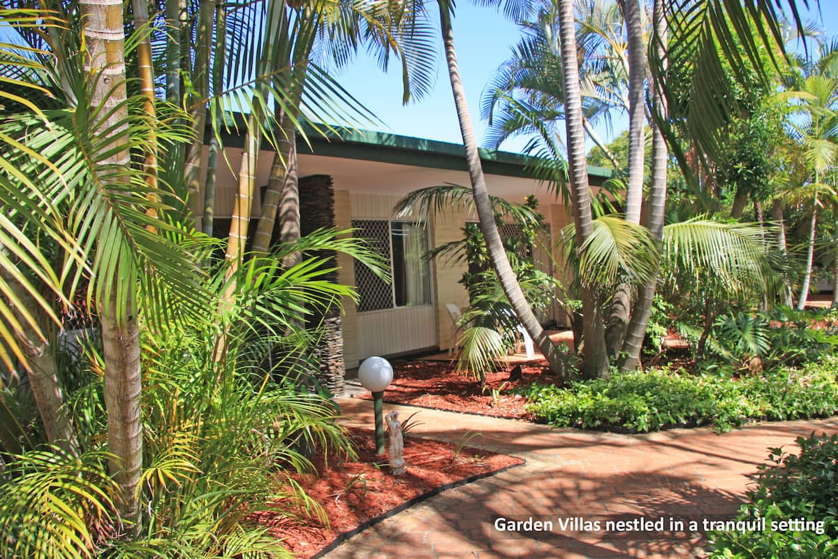 A garden with villas nestled in a tranquil setting.