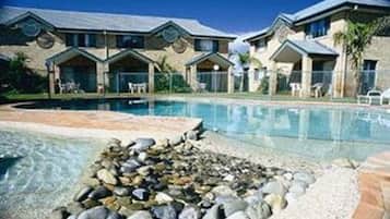 Outdoor pool, a heated pool, open 8:00 AM to 6:00 PM, pool umbrellas