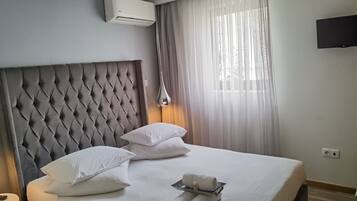 Standardsuite | Dundyner, individuelt design, mørklægningsgardiner, lydisolering