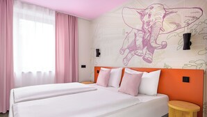 A hotel room with two beds, a large window with pink curtains, and a wall mural of an elephant. - McDreams Hotel Wuppertal City (Wuppertal)