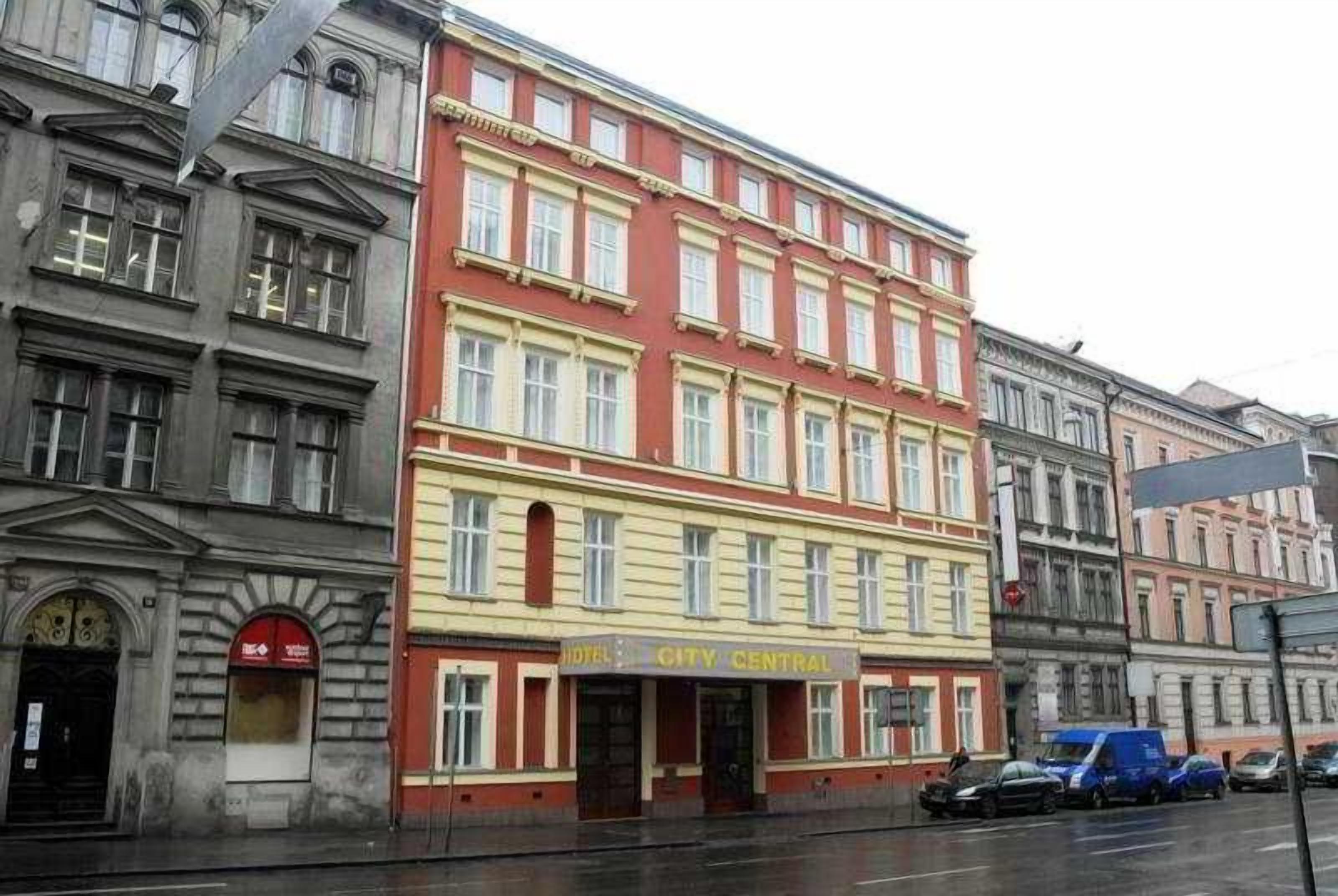 A multi-story building with a prominent sign reading "HOTEL CITY CENTRAL".