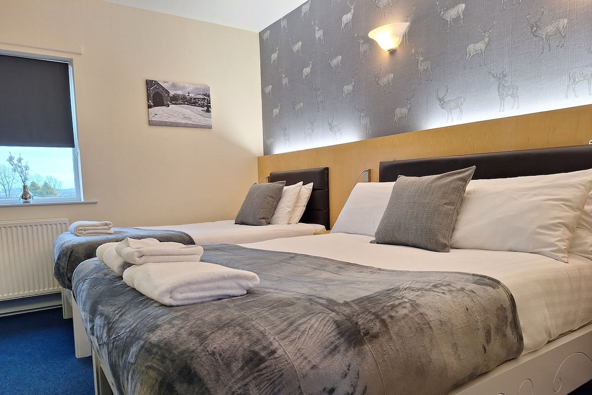 Family Room | Individually decorated, desk, iron/ironing board, cribs/infant beds