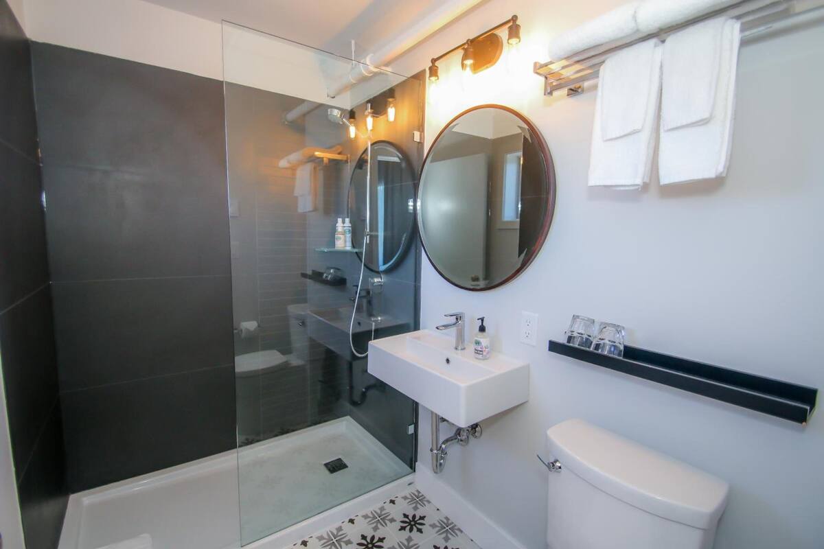 shower, eco-friendly toiletries, hair dryer, towels