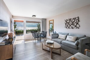 Oceanfront One Bedroom Suite | Living area | Flat-screen TV, pay movies - Gurney's Montauk Resort & Seawater Spa (Montauk)
