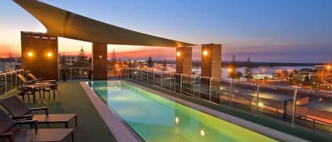 Outdoor pool, open 8:30 AM to 10:00 PM, pool loungers