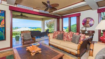 Deluxe Condo, 3 Bedrooms | Living room | Flat-screen TV, DVD player
