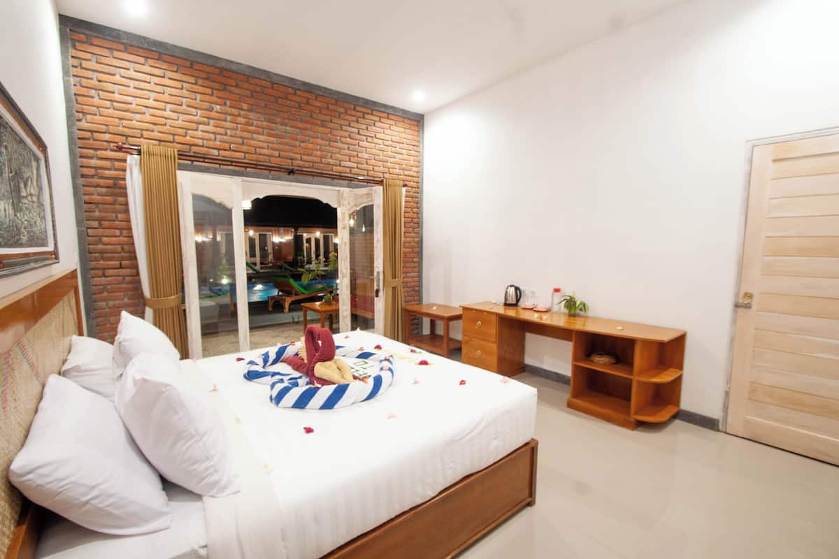 ห้องดีลักซ์ดับเบิลหรือทวิน, วิวสวน | เตียงพร้อมฟูกเสริมที่นอน, ตู้นิรภัยในห้องพัก, โต๊ะทำงาน, ผ้าม่านกันแสง