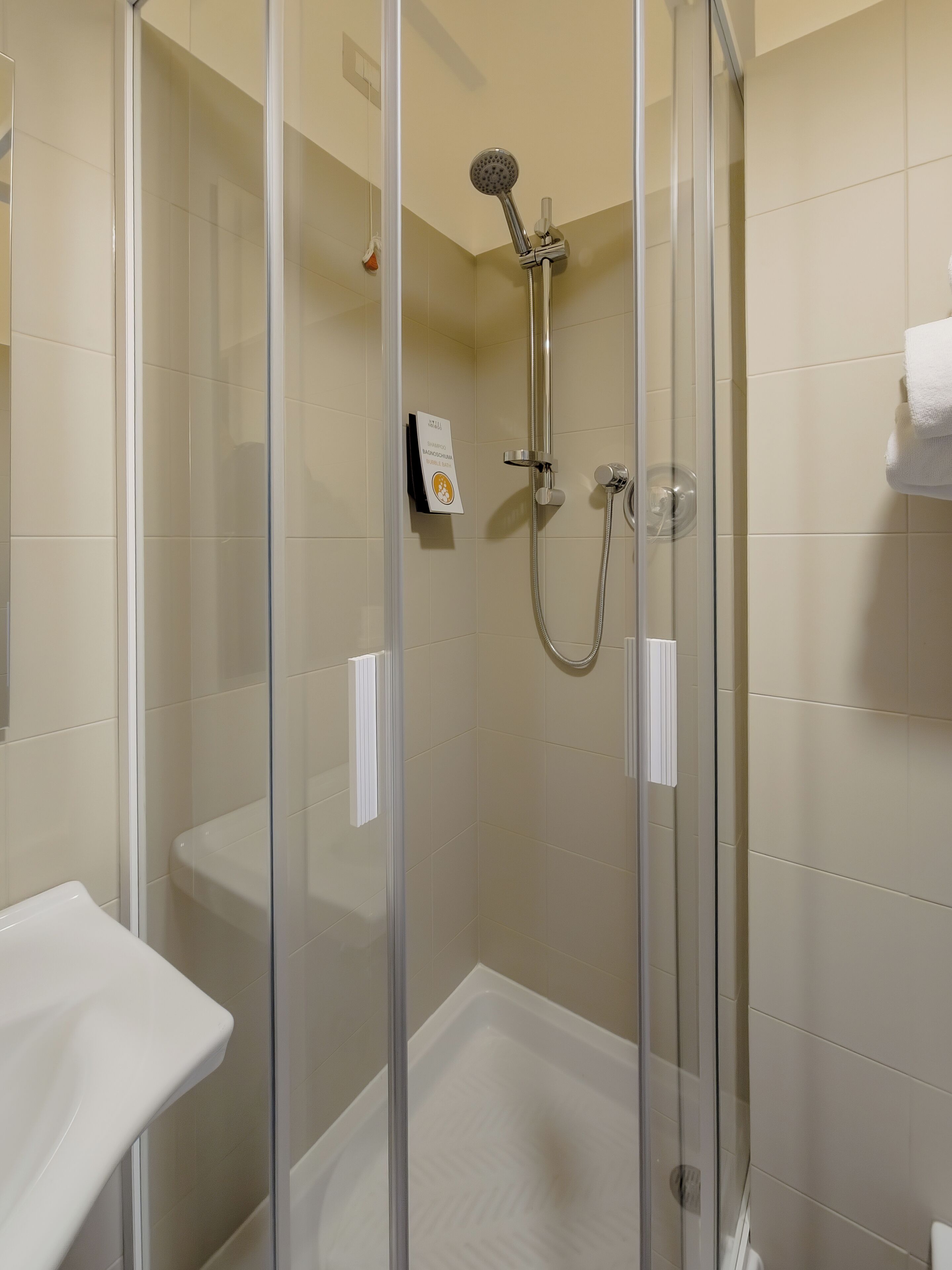 deluxe quadruple room | bathroom | deep-soaking bathtub, rainfall showerhead, bidet, towels
