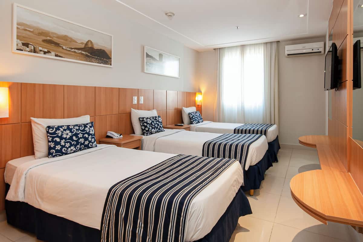 Deluxe Triple Room, 3 Twin Beds | Minibar, in-room safe, desk, soundproofing